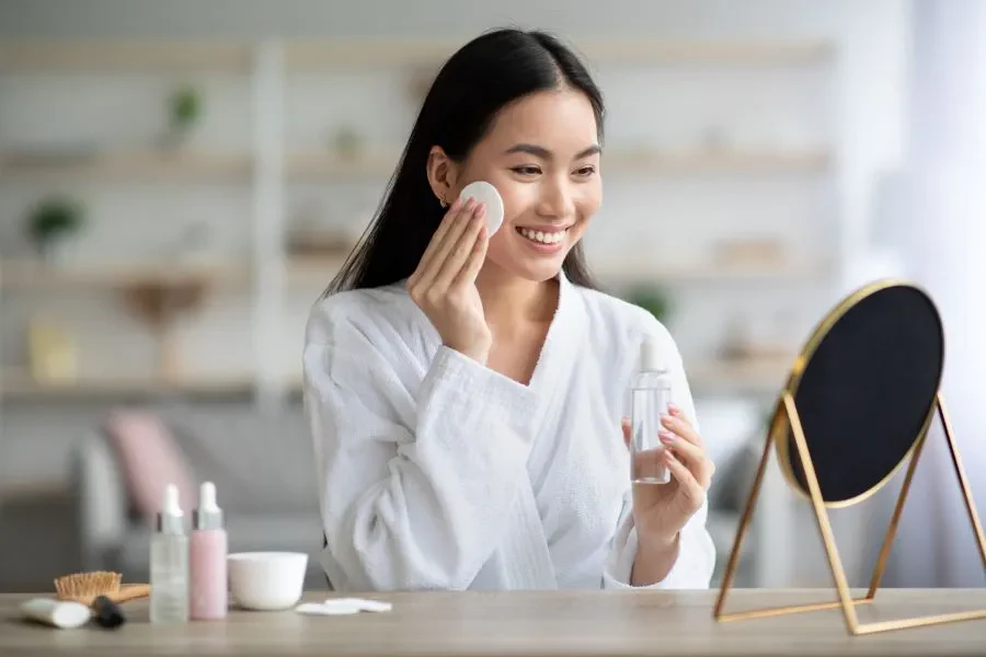 Woman applying toner